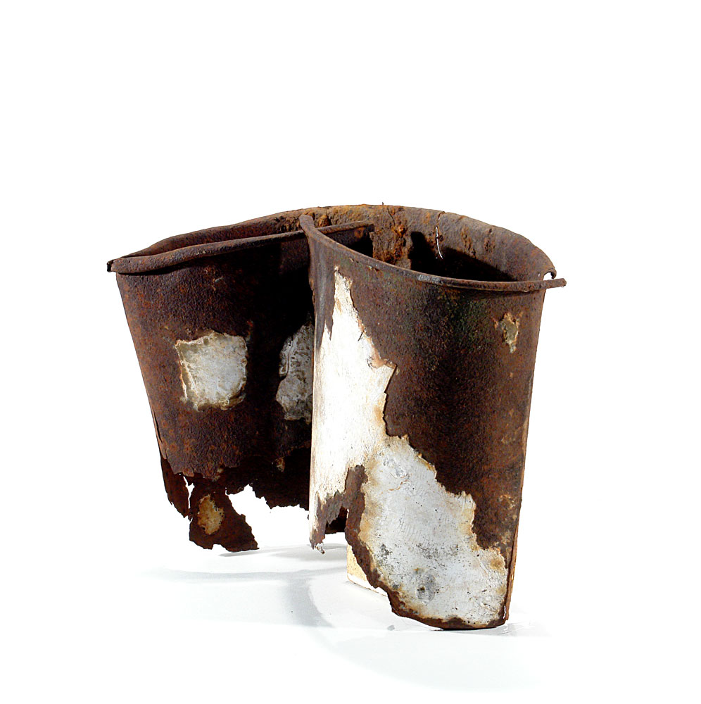 a metal bucket rusted, slightly damaged