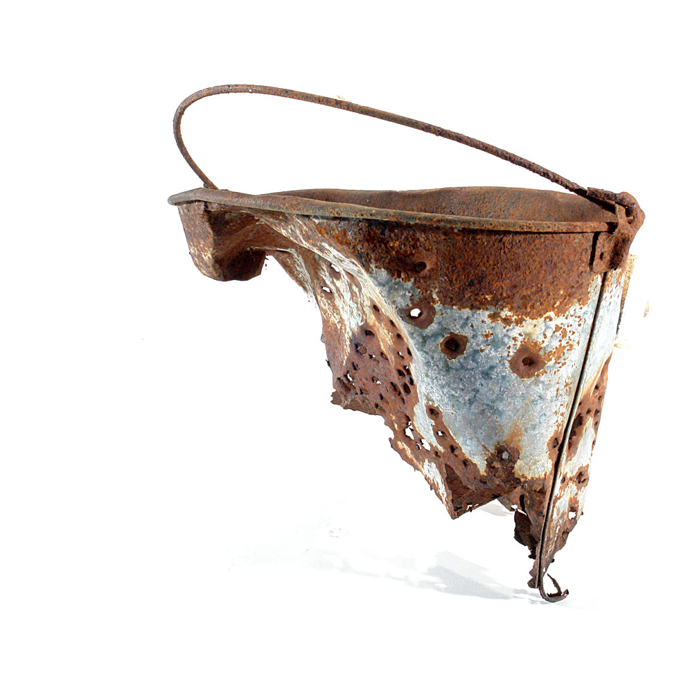 a metal bucket rusted, slightly damaged