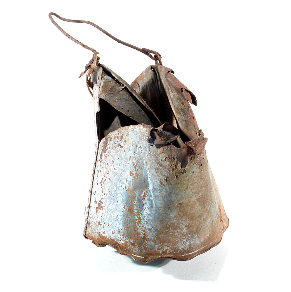 a metal bucket rusted, slightly damaged