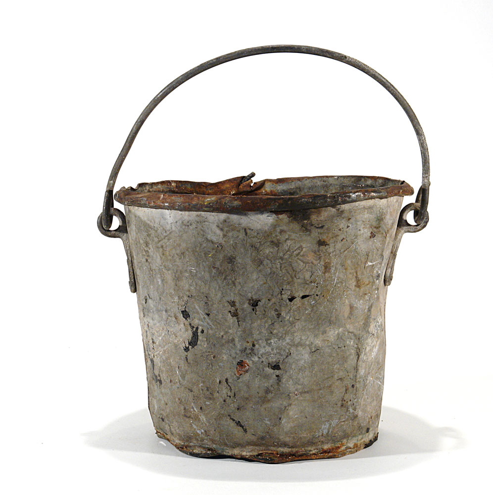 a metal bucket rusted, slightly damaged
